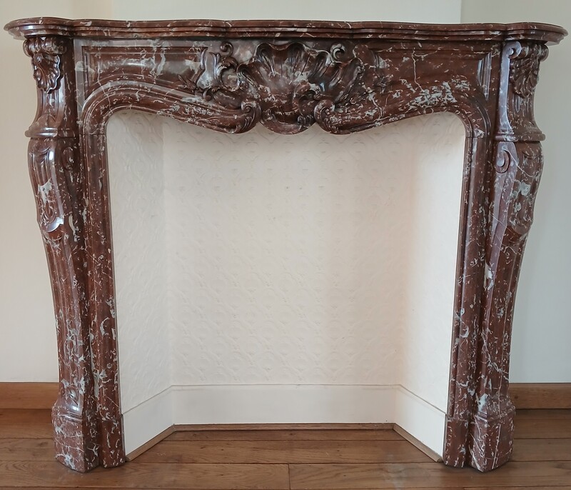 Large Louis XV fireplace made out of a striking-red marble