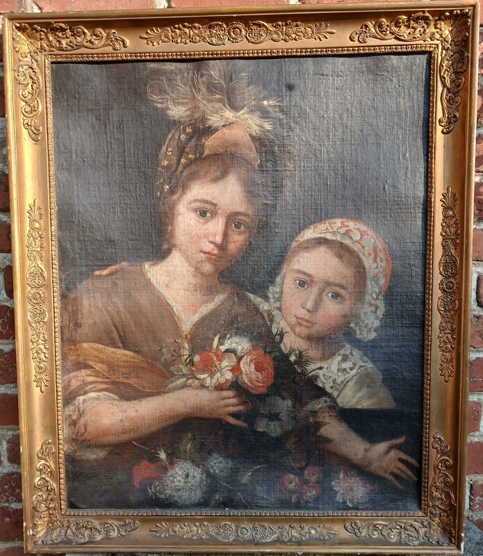 Portrait of a mother and daughter with a bouquet of flowers.